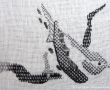 Spanish Backwork counted thread hand embroidery of a sparrow bird on even weave linen fabric